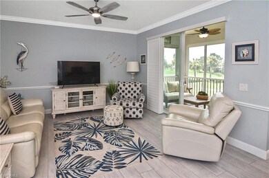 Living area with ceiling fan, crown molding, and light wood-type flooring