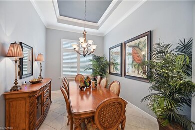 Dining room with light tile patterned flooring, a 