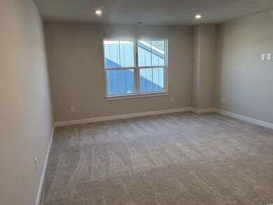 Carpeted empty room featuring recessed lighting an