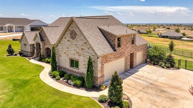 Garage side view showing fenced back yard and views for miles from this homes elevation.
