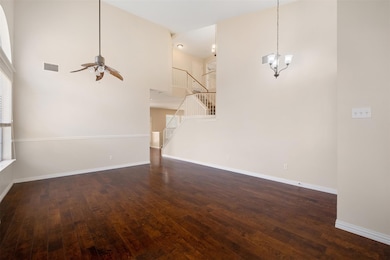 Unfurnished living room with hardwood / wood-styl