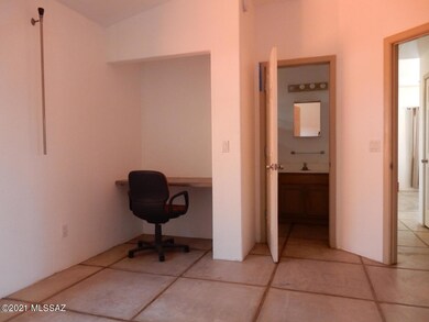 Bedroom with built in desk