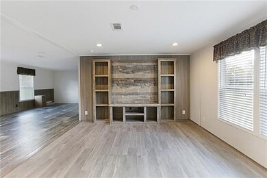 Living room with Built-Ins open to the Kitchen.