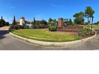 Community sign featuring a lawn
