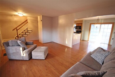 Living room open to breakfast/dining.