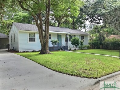This driveway leads to carport in back yard.