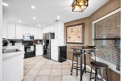 Kitchen featuring stainless steel appliances, a br