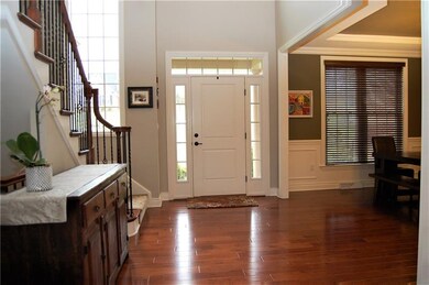 Beautiful hardwood flooring graces the two story f