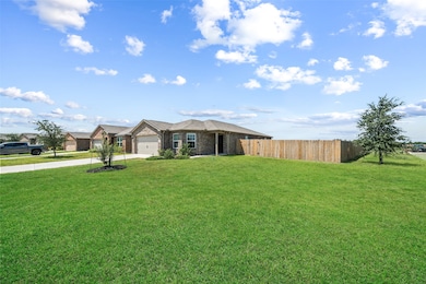 Expansive corner lot with a large grassy yard provides curb appeal and outdoor space to enjoy.