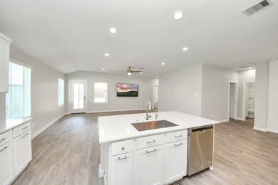 Kitchen Open to Living Room and Dining Area