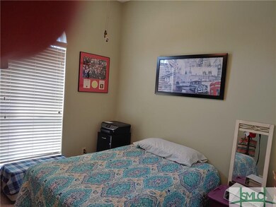 Front bedroom with high ceiling.