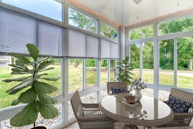 Sunroom with a ceiling fan