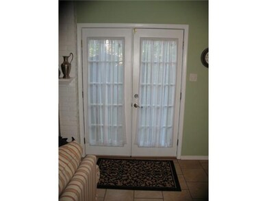 Den with French Doors to Fenced Patio