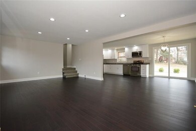 Spacious living room and dining room area lead int