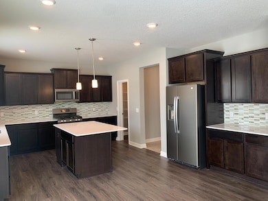 The dinette situated next to the breakfast bar makes those early mornings a breeze. Model photo