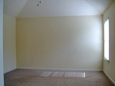 Large master bedroom with coffered ceiling and fan