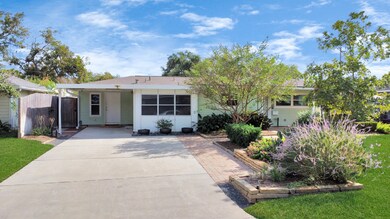 The extra wide driveway provides ample parking spa
