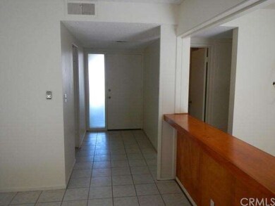 Tiled front entry with obscured glass sidelight 