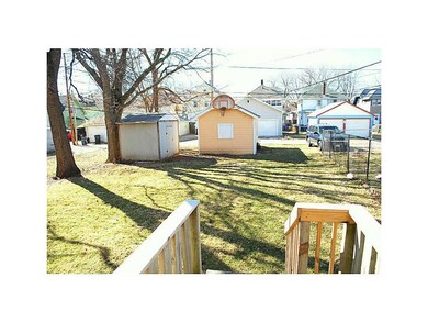 Yard. Garage & shed off the alley.