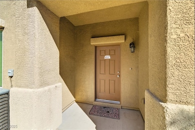 Entrance to property featuring stucco siding and a porch