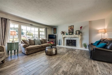 SPACIOUS LIVING ROOM THAT FEATURES GORGEOUS PORCEL
