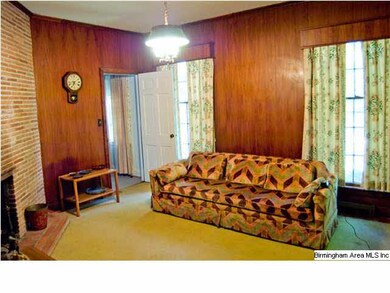 Den is behind Living Room and shares fireplace
