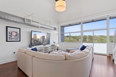 Living area featuring baseboards, dark wood-style