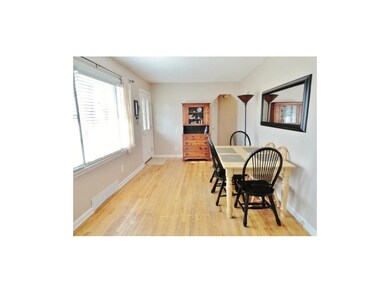Open entry with picture window at dining area.