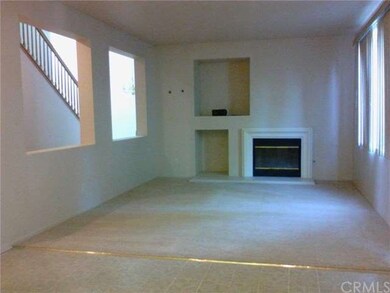 Family room from kitchen. Open wall gives view of 
