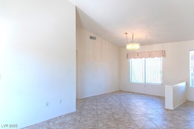 High vaulted ceiling, tile flooring.