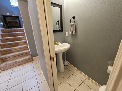 Bathroom with tile patterned flooring