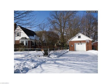 Detached one car  garage with opener and paved dri