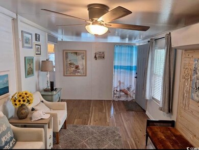 Living area with light wood-style floors