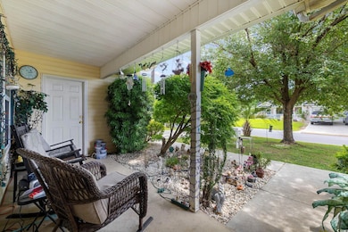 Porch featuring a yard