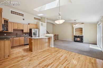 Unfurnished living room featuring vaulted ceiling,