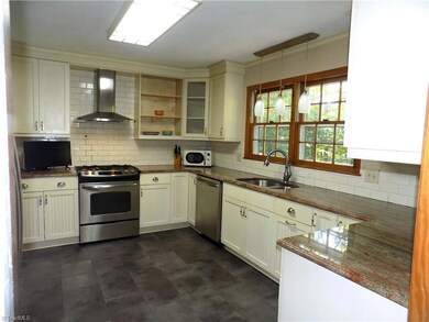Custom kitchen w/ gas range and vented hood