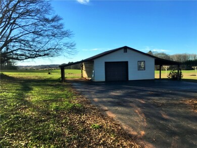 24x24 garage with a separate room/work area and al