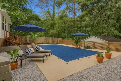 View of swimming pool featuring a fenced backyard, a patio, and stairway
