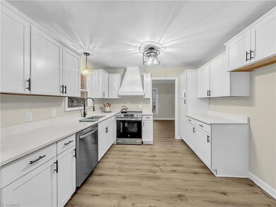 Kitchen with new cabinets and beautiful quartz