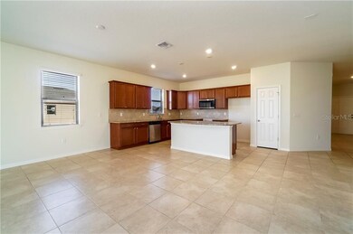 The open kitchen overlooks the family room.