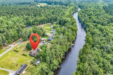Aerial view of a large body of water and a heavily wooded area
