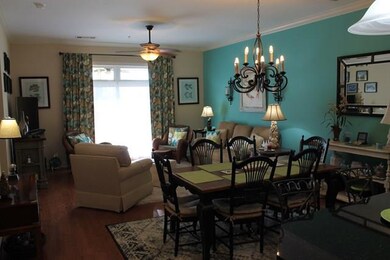 living and dining looking to screen porch
