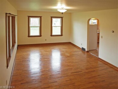 Random plank hardwood floors throughout the living