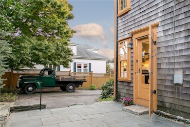 Back door entry into kitchen and patio from drivew