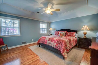 The Master Suite is an oasis with beautiful hardwo