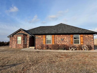 Ranch-style house featuring brick siding, a front 
