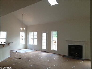 Interior Space/Layout - Huge family room with beautiful hardwood floors, vaulted ceiling with sky light & gas fireplace