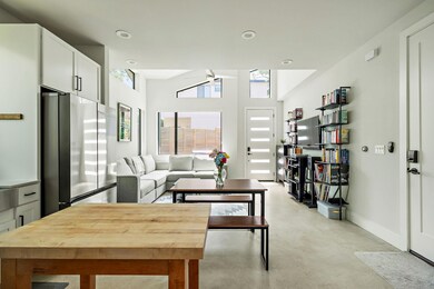 Living room with finished concrete floors, basebo