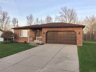2 car garage with concrete driveway.