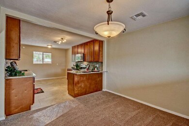 OPEN KITCHEN TO DINING W/ BREAKFAST BAR